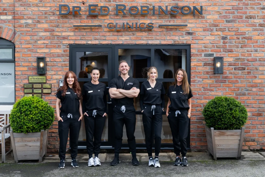 The Dr Ed Robinson Clinics team outside the clinic in Hale